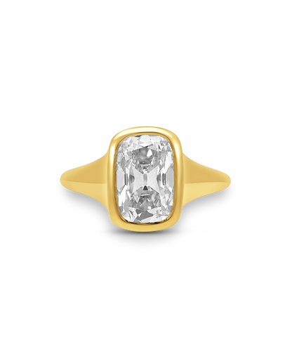 Gold ring with a large diamond on a white background