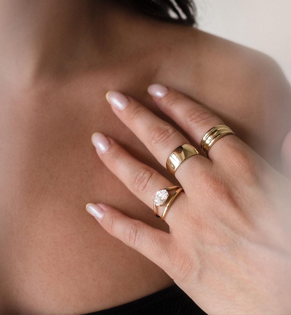 Solitaire engagement ring and solid gold stacking rings
