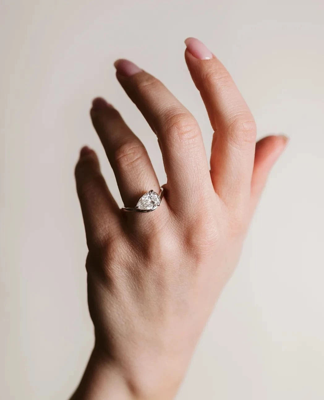 East-West Solitaire Engagement Ring 1.50 Carat Lab-grown Pear Shaped Diamond | 14kt White Gold